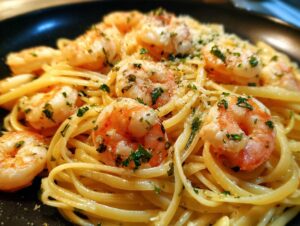 A close-up of delicious shrimp scampi served over linguine pasta, garnished with parsley and parmesan cheese.