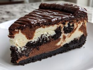 A decadent slice of 3-layer chocolate cheesecake featuring a dark crust, marbled filling, and rich chocolate ganache topping.